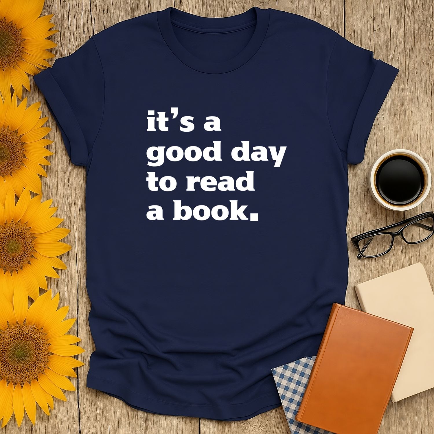 Cozy navy t-shirt with bold white text: 'it's a good day to read a book.' Perfect gift for book lovers, cats, coffee, or tea.