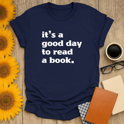 Cozy navy t-shirt with bold white text: 'it's a good day to read a book.' Perfect gift for book lovers, cats, coffee, or tea.
