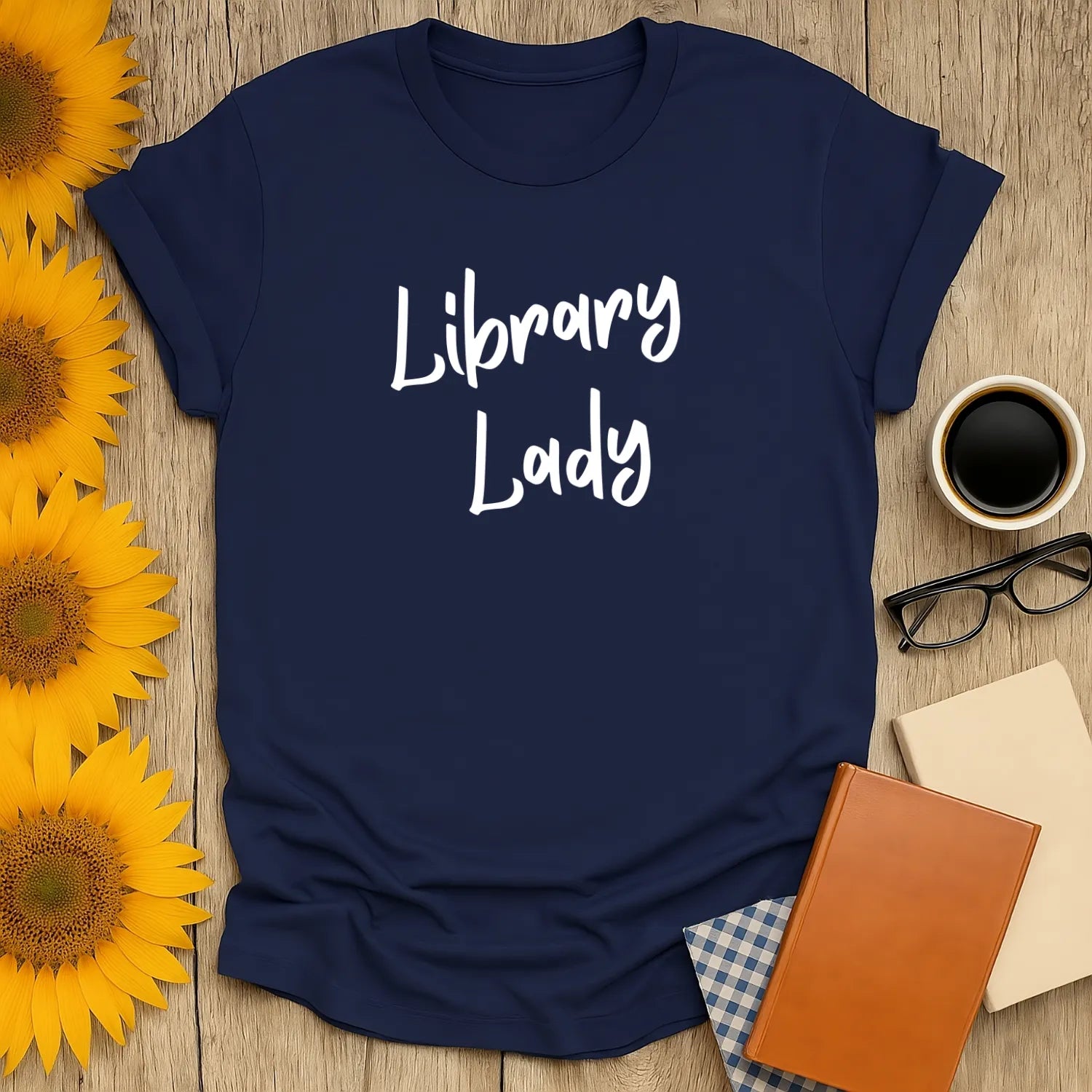 Navy Library Lady t-shirt with playful text, perfect for book lovers who adore cats, coffee, and cozy reading experiences.