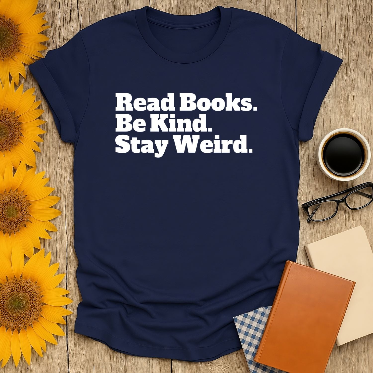 Stay Weird T-Shirt with bold text: 'Read Books. Be Kind. Stay Weird.' Perfect for book lovers and cat enthusiasts.