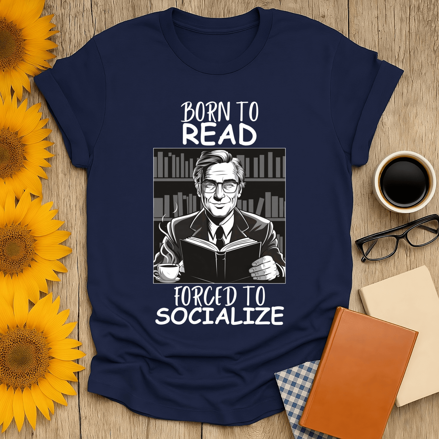 Born to Read, Forced to Socialize T-Shirt for book lovers, featuring a smiling character with books in a stylish design.