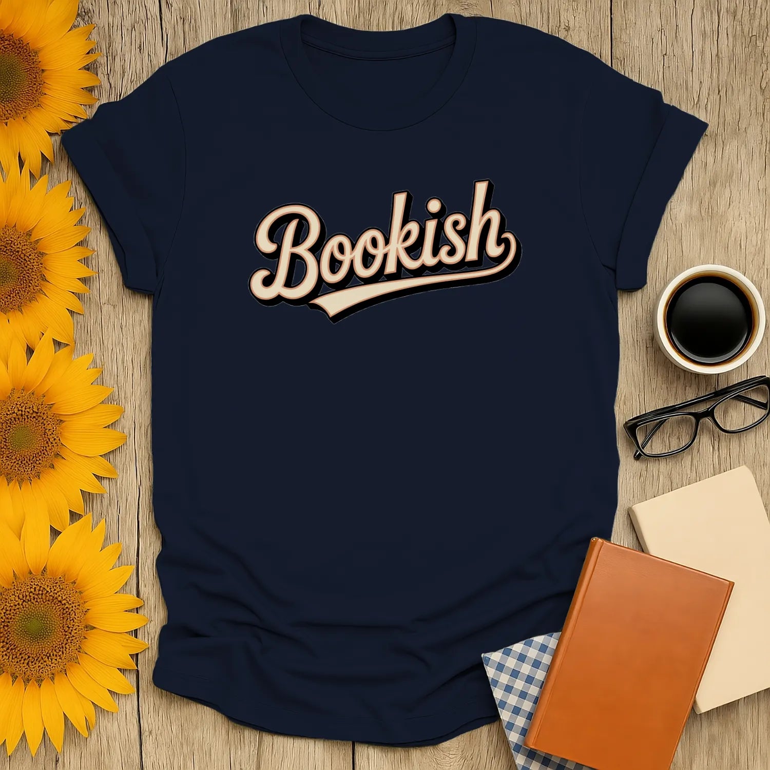 Navy tee with 'Bookish' in stylish font, perfect for book lovers who enjoy cozy reads, cats, and coffee.