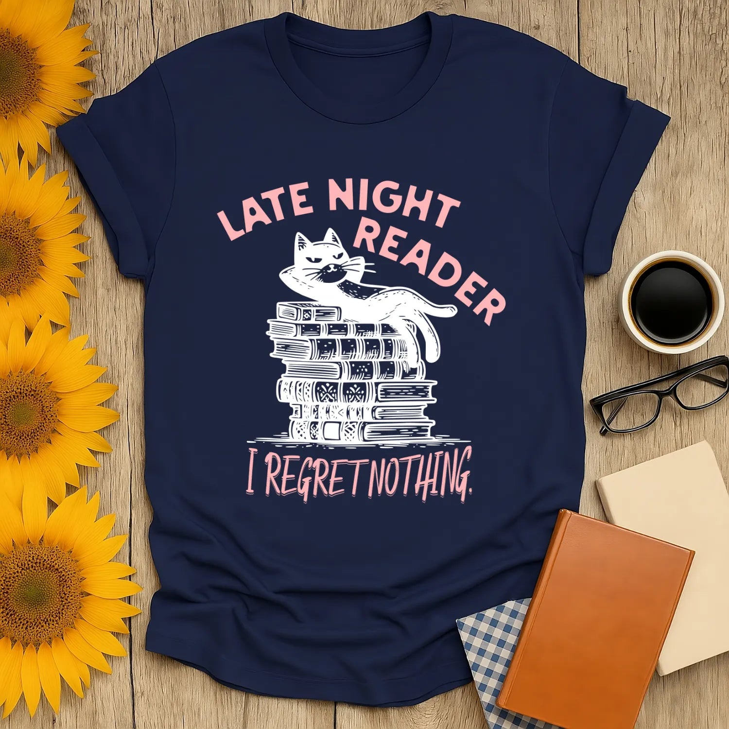 Late Night Reader T-Shirt featuring a relaxed cat on books, saying 'I Regret Nothing'—perfect for cozy readers and cat lovers!