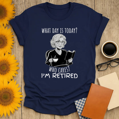 What Day is It? T-Shirt in navy featuring a retired woman reading with a coffee, perfect cozy gift for readers 📖☕️.