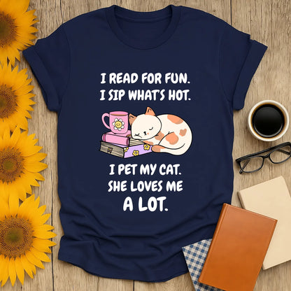 Navy t-shirt featuring cute cat, coffee cup, and playful text: 'I read for fun, I sip what's hot, I pet my cat.'