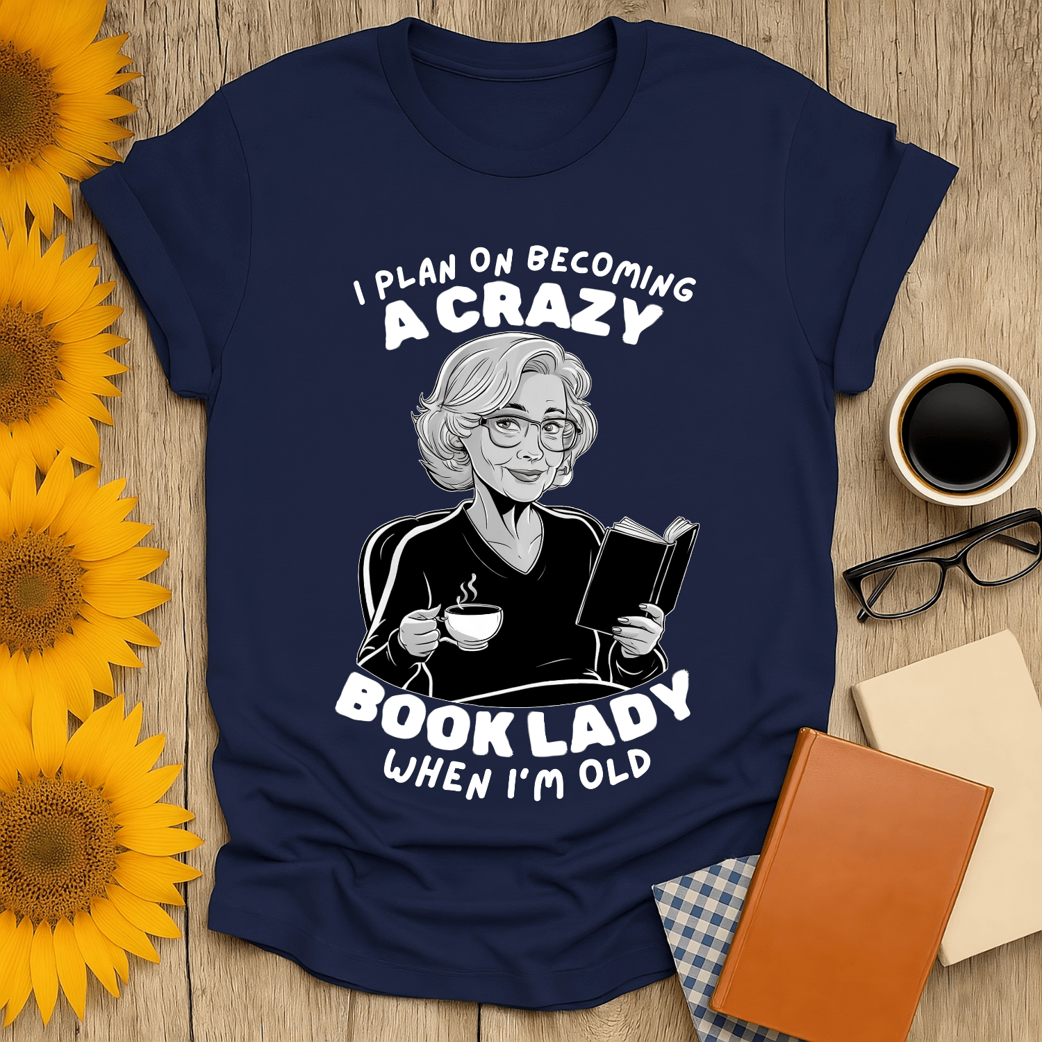 Crazy Book Lady t-shirt design featuring a woman reading while sipping tea, perfect for book lovers.