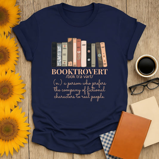 Booktrovert T-shirt design featuring stacked books and a definition, perfect for book lovers. Made from soft, breathable cotton.