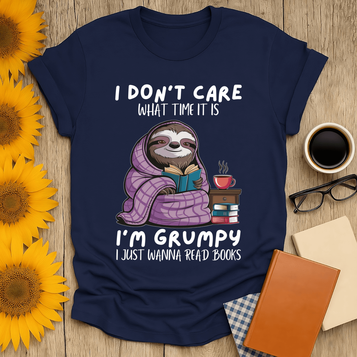 Grumpy sloth book lover t-shirt with fun design, perfect for cozy reading days. Made from 100% ring-spun cotton.