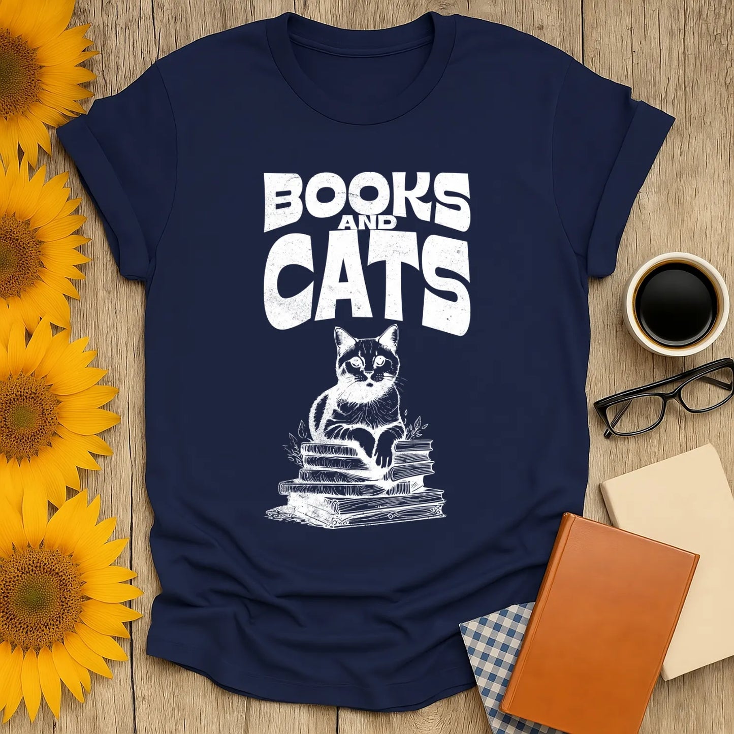 Books & Cats Club T-Shirt featuring a cat on a stack of books, perfect for cozy book lovers and cat enthusiasts.