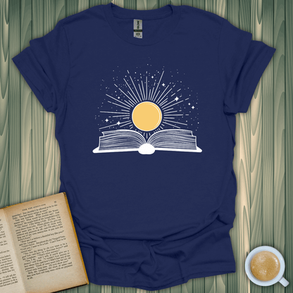 Sunshine Kiss T-Shirt featuring a sun over an open book design, perfect for book lovers. Crafted from breathable cotton.