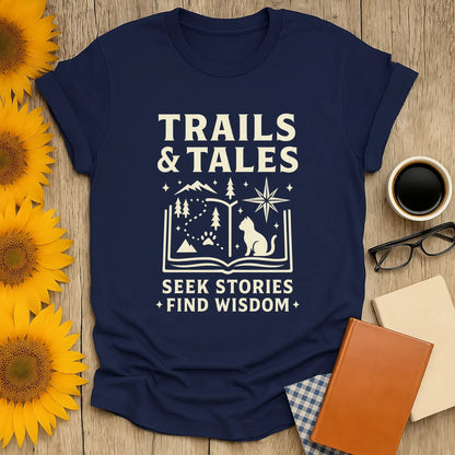 Trails & Tales t-shirt featuring mountains, a wise cat, and the text 'Seek Stories Find Wisdom'—the perfect gift for book lovers.