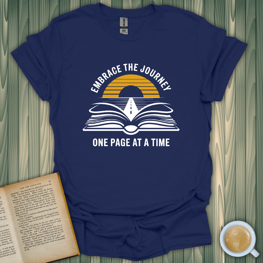 Embrace The Journey T-Shirt for book lovers, with a vibrant design featuring an open book and sunset, perfect for casual wear.