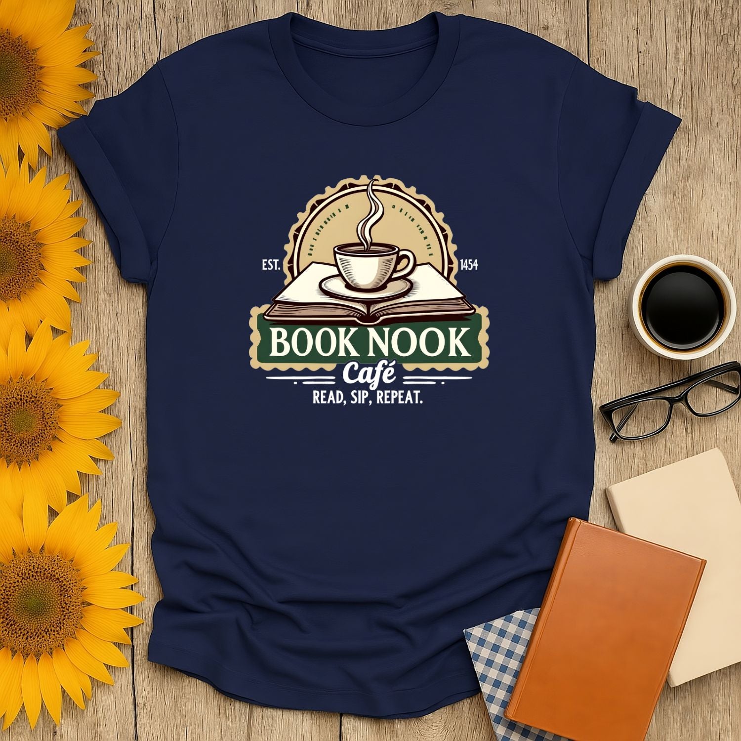 Cozy Book Nook Vibes T-Shirt featuring a steaming coffee cup on a book; perfect gift for cat lovers and readers.