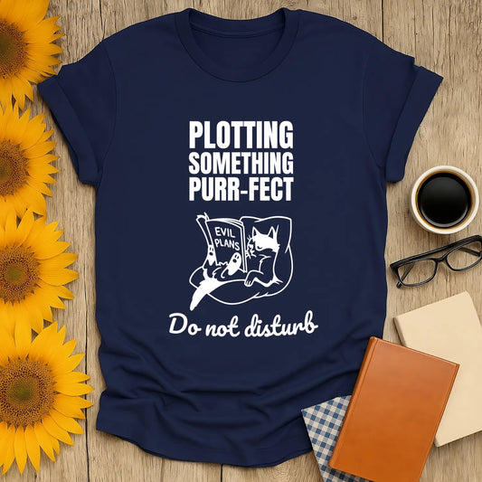 Navy shirt with a cat reading 'Evil Plans' and text: 'Plotting Something Purr-fect. Do Not Disturb'. Perfect for book lovers!