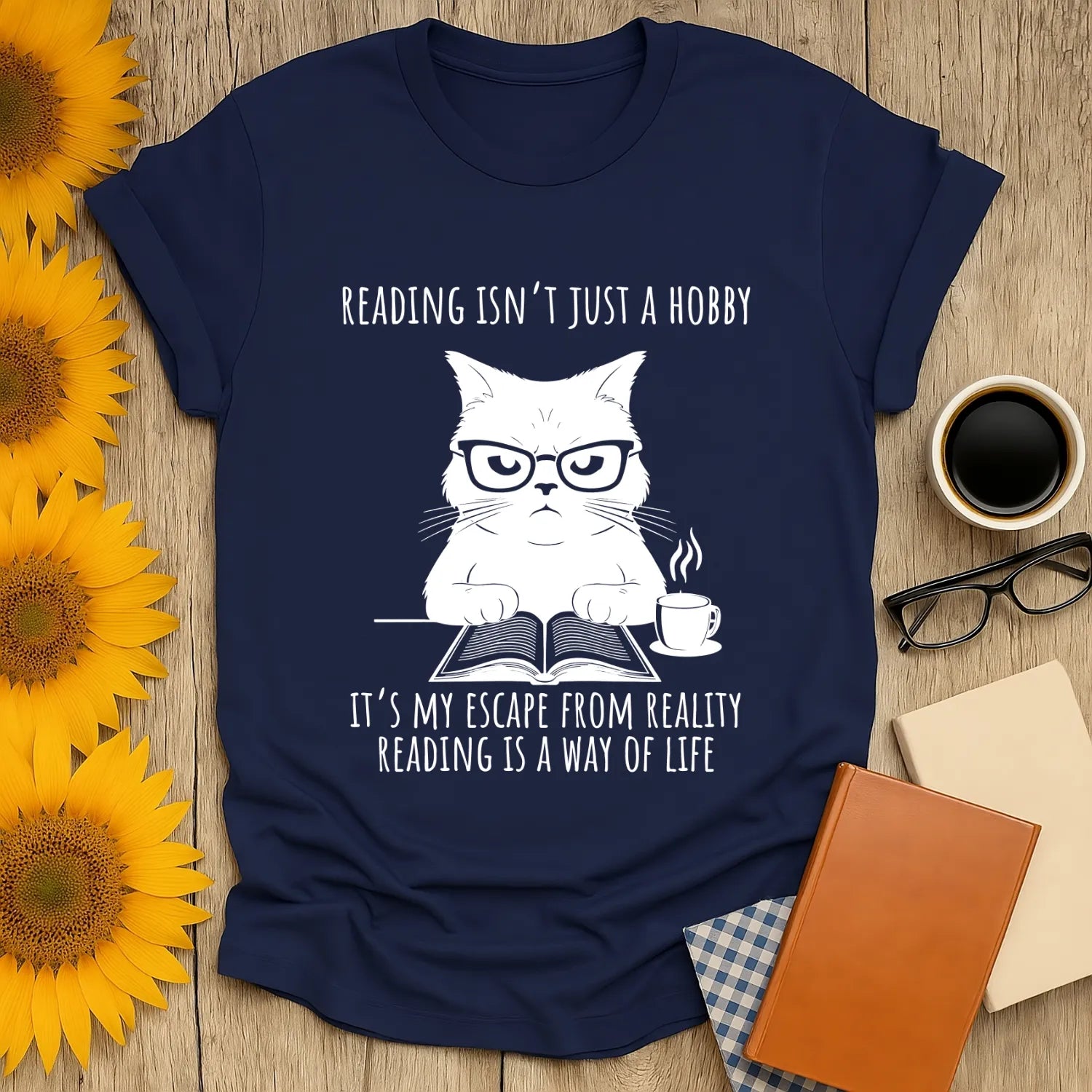 Funny cat reading shirt with text: 'Reading isn’t just a hobby, it’s my escape from reality.' Perfect for book lovers!