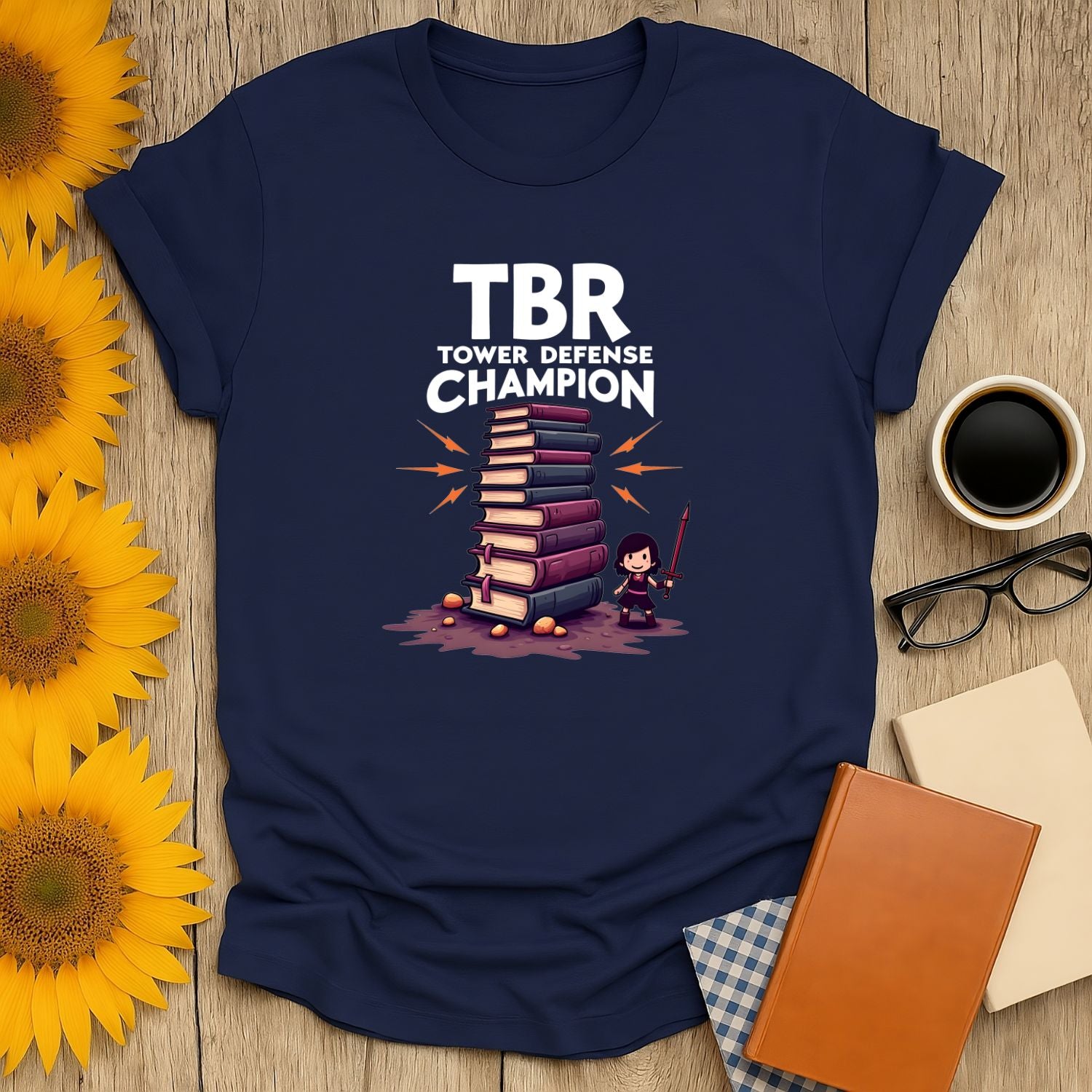 TBR Defender T-Shirt featuring a playful design with books and a character, perfect for book lovers.