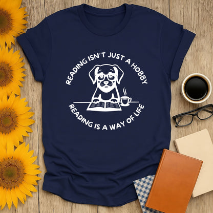 Reading is not just a hobby t-shirt featuring a cute dog, perfect for book lovers and reading enthusiasts.