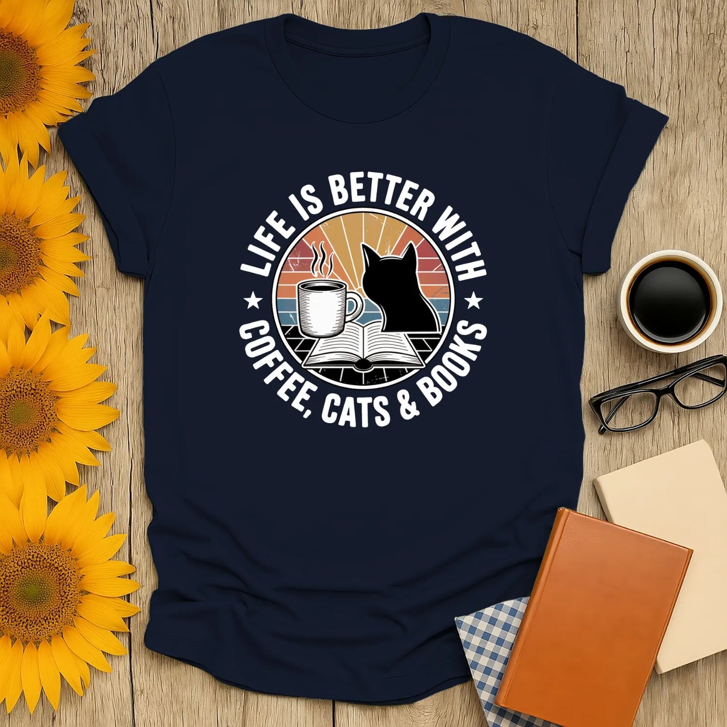 Cute navy shirt with cat, coffee, and open book design; perfect gift for cozy book lovers and readers.