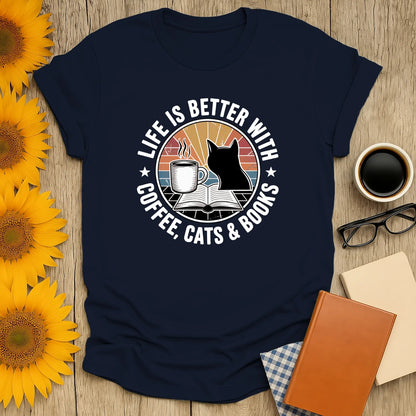 Cute navy shirt with cat, coffee, and open book design; perfect gift for cozy book lovers and readers.
