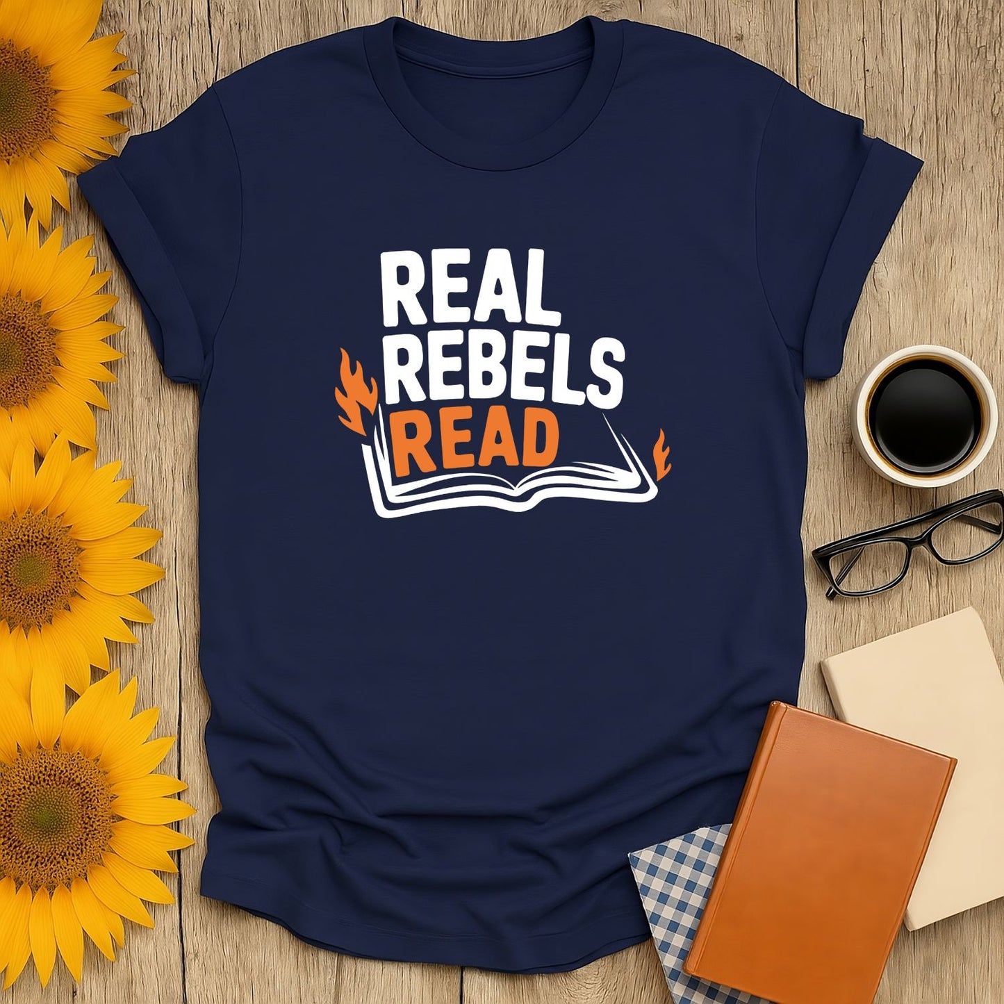 Real Rebels Read T-Shirt featuring bold text and an open book, perfect for book lovers who adore cats, coffee, or tea.