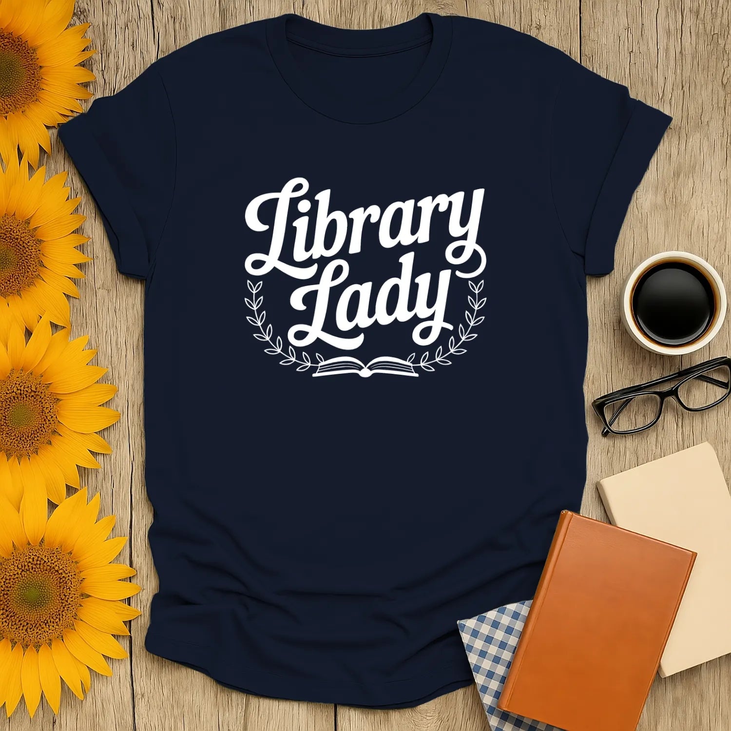 Cozy book lover shirt featuring 'Library Lady' text, perfect for cat and coffee fans. A funny reading tee for bookworms.