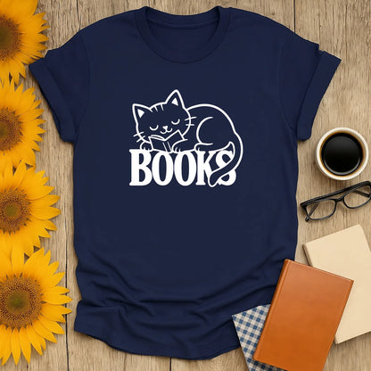 Cozy navy tee with a cute cat napping on the word 'BOOKS'—perfect for book lovers and cat enthusiasts.