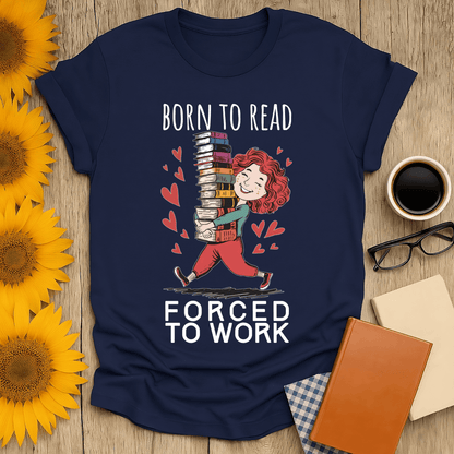 Born to read forced to work t-shirt for book lovers, featuring playful design on navy cotton fabric.