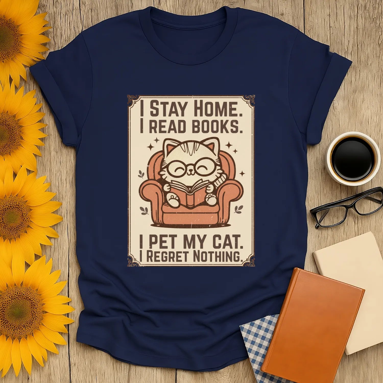Poster Cat Reader T-Shirt featuring a cozy illustration of a cat in glasses reading in a chair, perfect for book lovers.