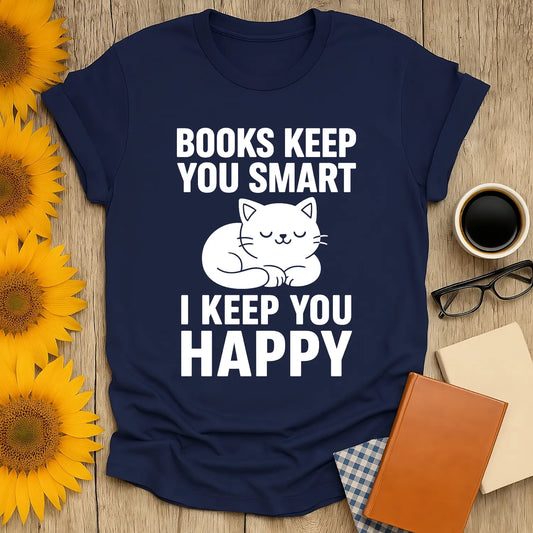 Cozy navy t-shirt with cat illustration and text saying 'Books Keep You Smart, I Keep You Happy' for book lovers.