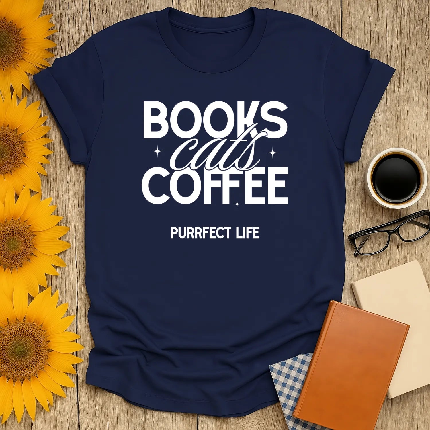 Trio of Joy T-Shirt with bold text 'Books, Cats, Coffee' celebrating book lovers and cozy reading moments - perfect gift!