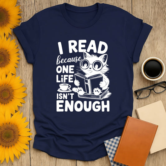 Navy blue t-shirt with a cat reading and 'I read because one life isn’t enough' text, perfect for book lover t-shirt enthusiasts.