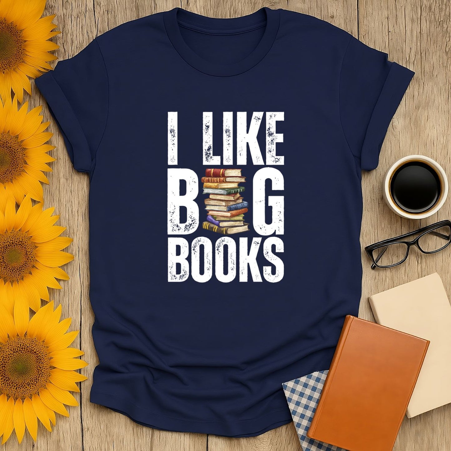 Funny reading tee saying 'I Like Big Books' with stacked books illustration, perfect cozy book shirt for cat and coffee lovers.