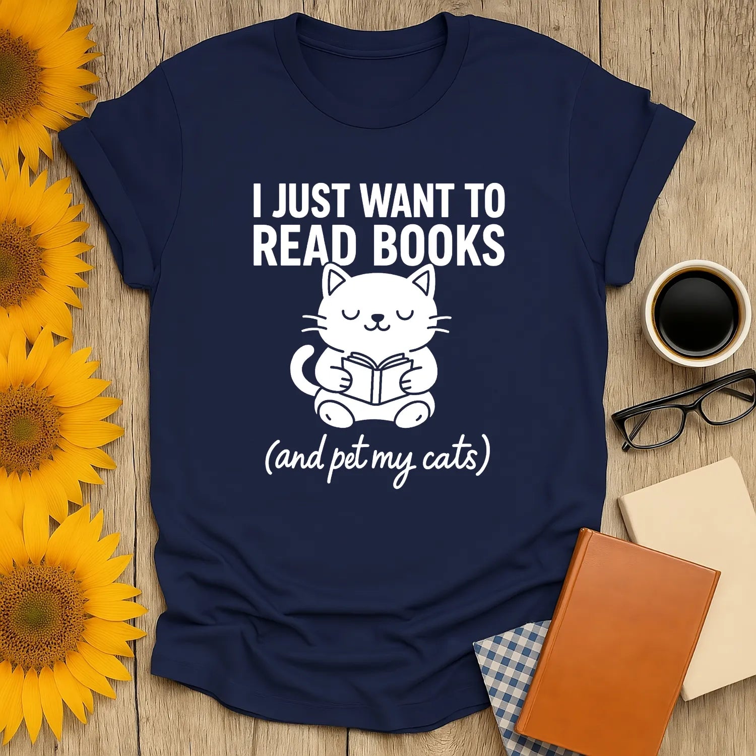 Cozy navy t-shirt with cute cat reading a book and text: 'I Just Want to Read Books (and pet my cats)'