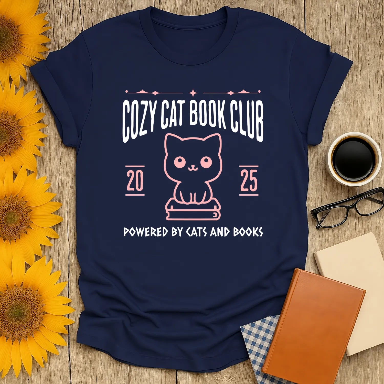 Cozy Cat Book Club T-Shirt featuring a cute cat illustration and text, perfect for readers who love cats and books.