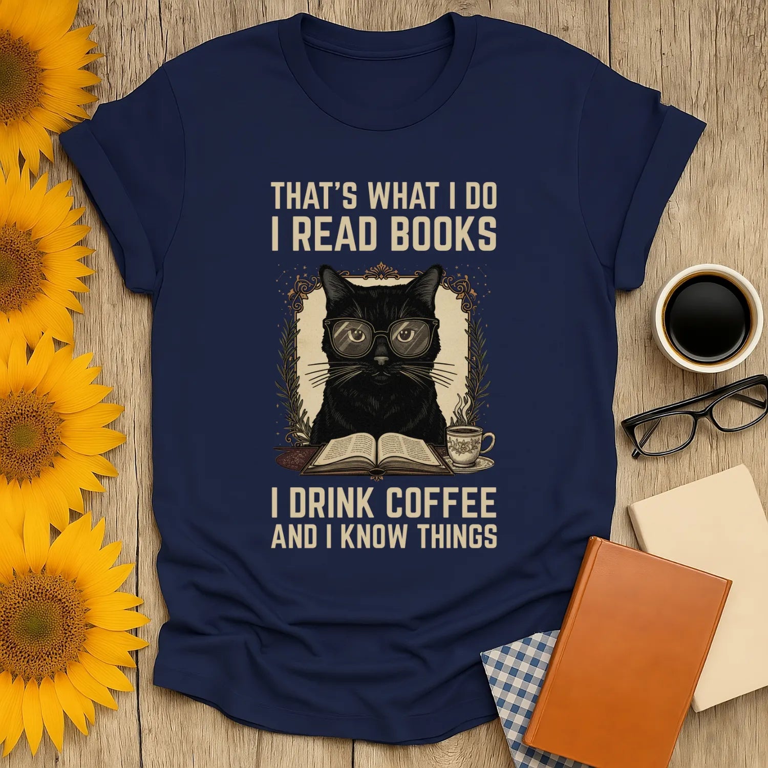 Coffee Cat Reader T-Shirt featuring a black cat in glasses with text: "That’s what I do, I read books, I drink coffee, and I know things."