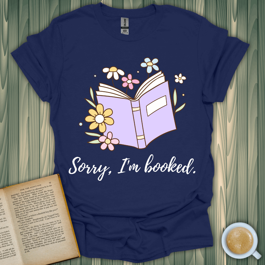 Sorry, I’m Booked T-Shirt for book lovers, featuring a colorful design with flowers and an open book.