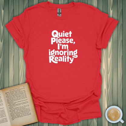 Red 'Quiet, I'm Ignoring Reality' T-shirt for book lovers, soft cotton, unisex fit, screen-printed in the USA.