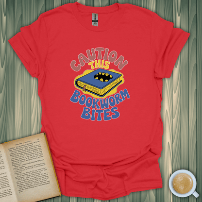 Caution This Bookworm Bites T-Shirt for book lovers, made of soft cotton with a fun design, perfect for casual wear.