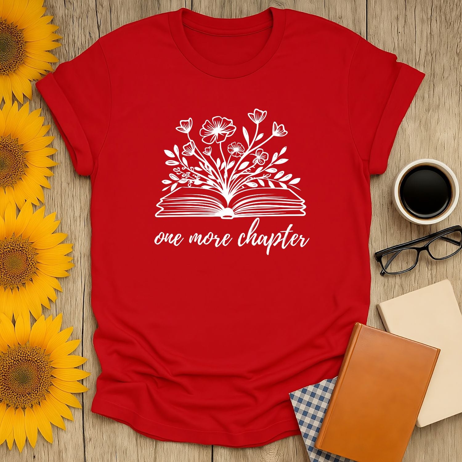 One More Chapter T-Shirt featuring a floral design above an open book, perfect for book lovers enjoying coffee or tea.