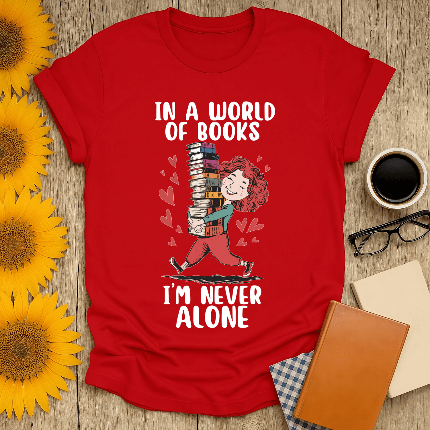 Red unisex t-shirt with the quote "In a World of Books I'm Never Alone" designed for book lovers.