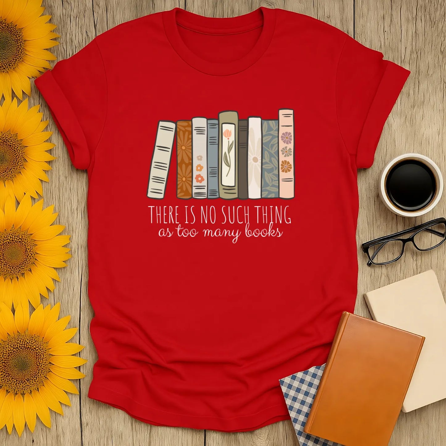 Red t-shirt with books illustration and text 'There is no such thing as too many books,' perfect for book lovers.