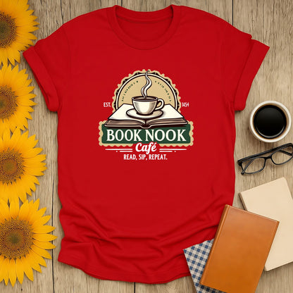 Cozy red t-shirt featuring 'Book Nook Cafe' with coffee, a book, and the slogan 'Read, Sip, Repeat'—perfect for book lovers!