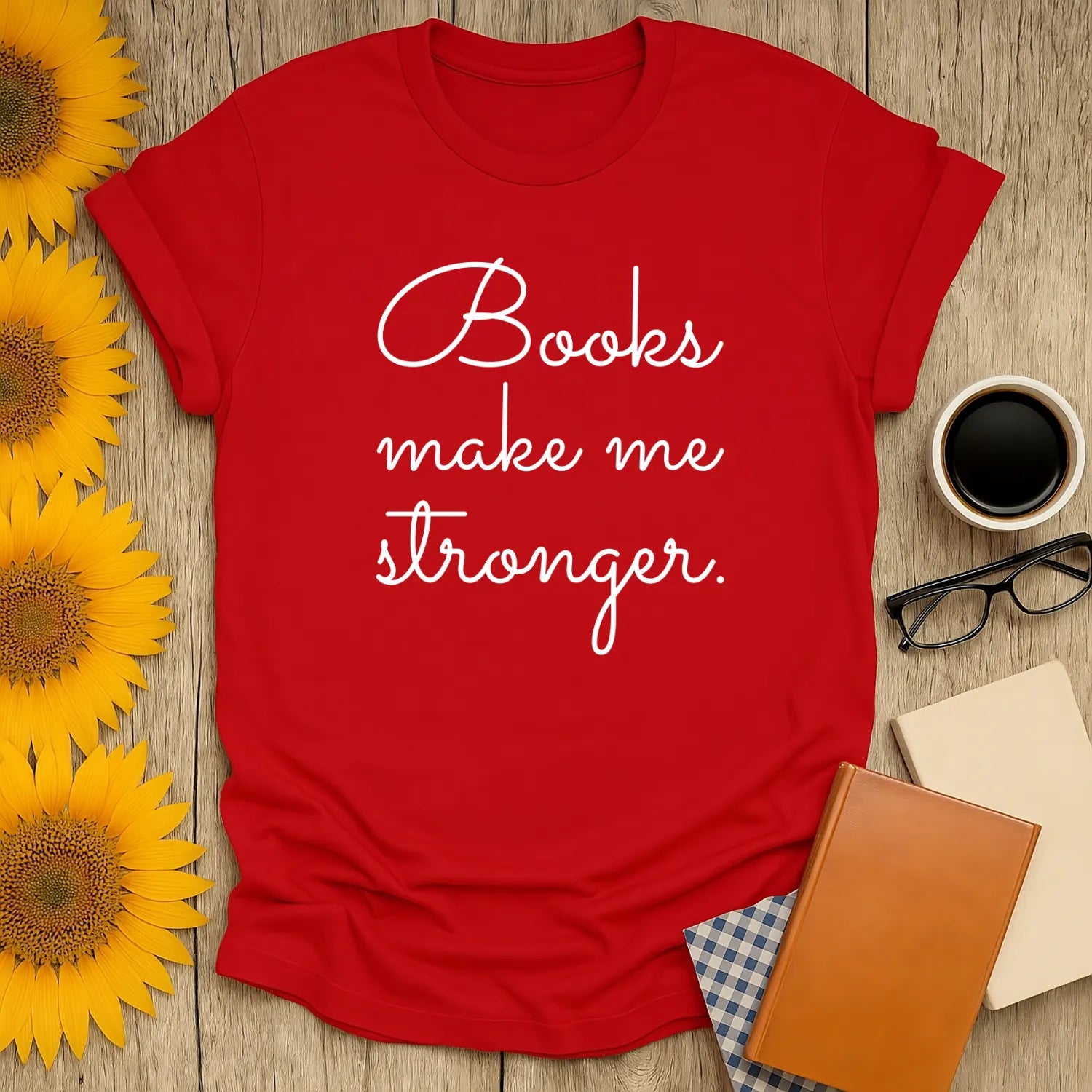 Cozy red t-shirt with "Books make me stronger" text, perfect for book lovers who enjoy cats, coffee, and witty reading humor.