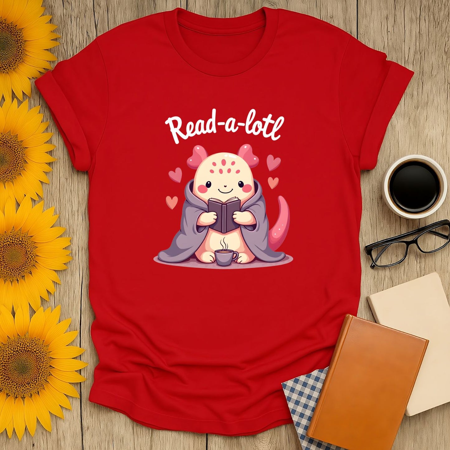 Read-a-lotl T-shirt featuring a cozy creature reading with hearts, perfect for book lovers and ideal gifts for readers.