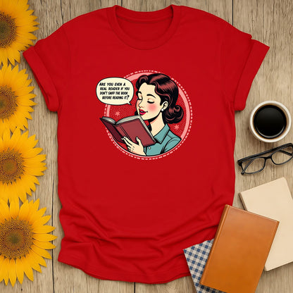 Funny reading tee with a woman contemplating a book, saying "Are you even a real reader if you don't taste it before reading it?" Perfect for book lovers!