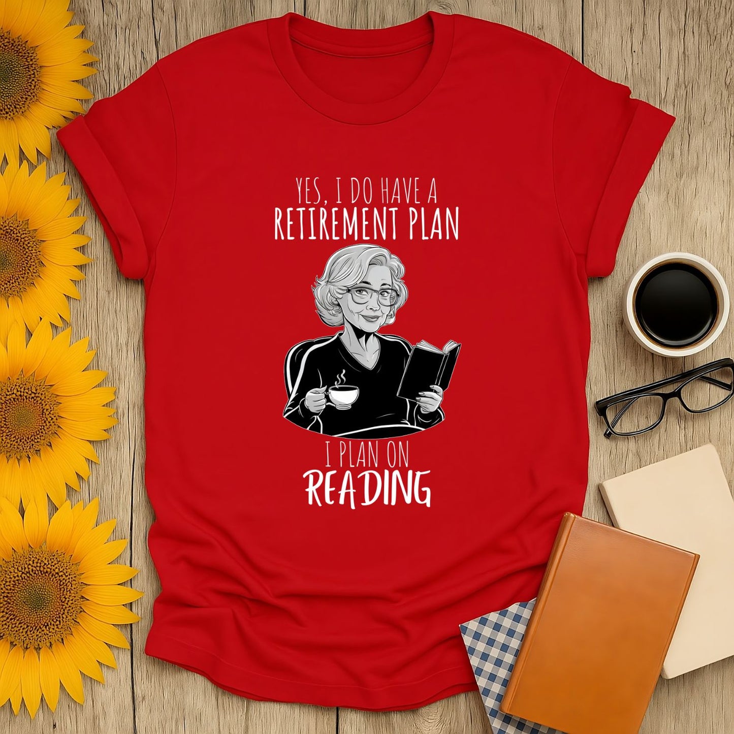 Funny reading tee with a cozy illustration, text: "Retirement Plan: I Plan on Reading"—perfect for book lovers who adore cats and coffee!