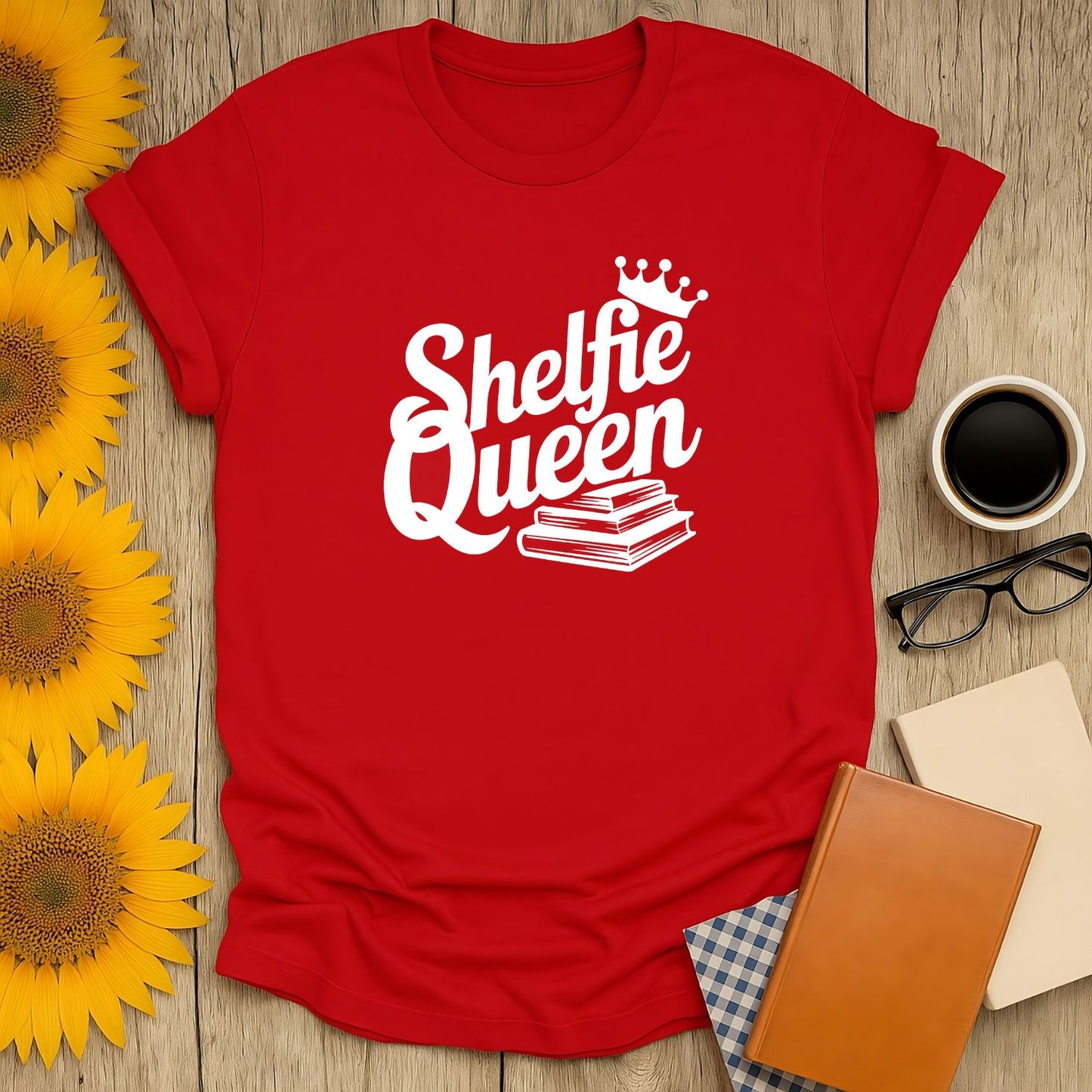 Red t-shirt reading 'Shelfie Queen' with books and a crown, perfect for cozy book lovers and gifts for readers.