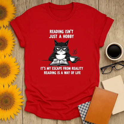 Grumpy book cat t-shirt featuring a playful quote, perfect for book lovers, made from soft, breathable fabric.