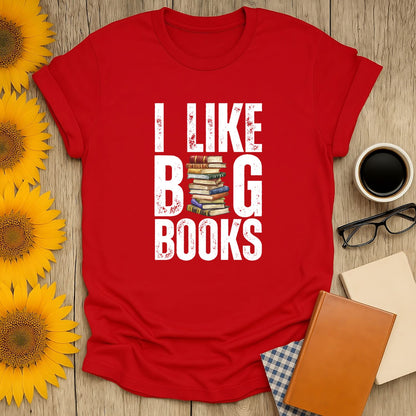 Funny reading tee featuring text 'I LIKE BIG BOOKS' with stacked books graphic, perfect cozy book shirt for cat & coffee lovers.