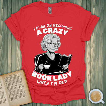 A fun red t-shirt featuring the text 'I plan on becoming a crazy book lady when I'm old' for book lovers.